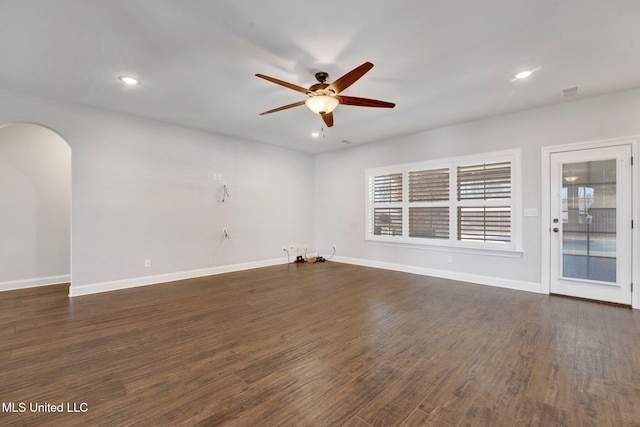 unfurnished room featuring dark hardwood / wood-style floors and ceiling fan