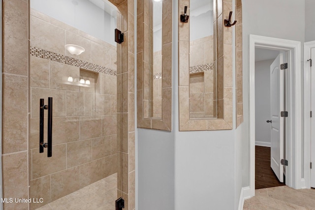 bathroom with a tile shower