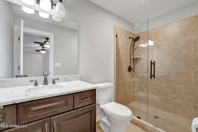 bathroom with toilet, walk in shower, ceiling fan, and vanity