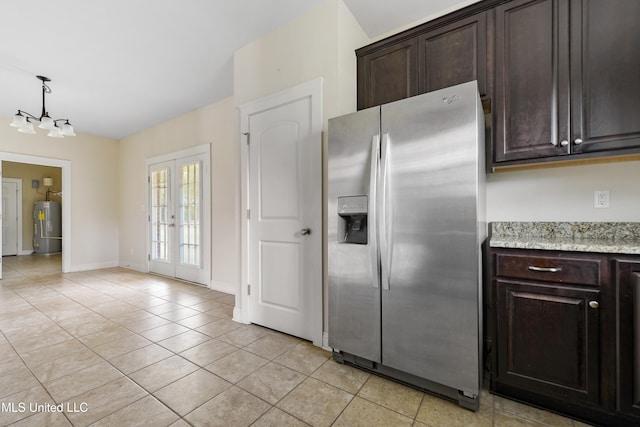 kitchen featuring french doors, electric water heater, stainless steel fridge, light tile patterned flooring, and dark brown cabinetry