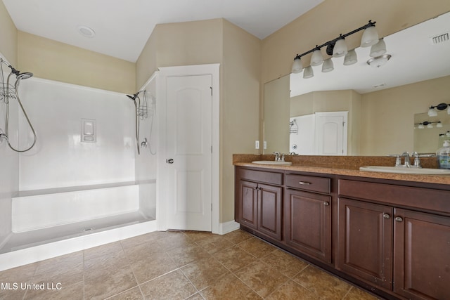 bathroom with vanity and tile patterned floors