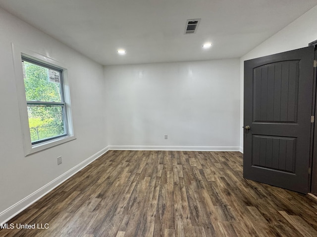 716 New Orleans St, Hattiesburg, MS 39401 - empty room with dark wood finished floors and recessed lighting
