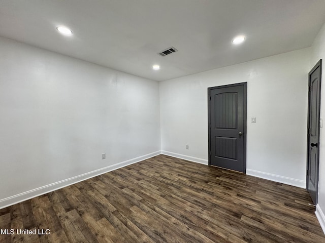 716 New Orleans St, Hattiesburg, MS 39401 - empty room with dark wood-style floors and recessed lighting