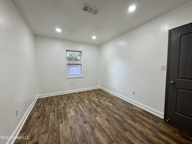 716 New Orleans St, Hattiesburg, MS 39401 - empty room with dark wood finished floors and recessed lighting