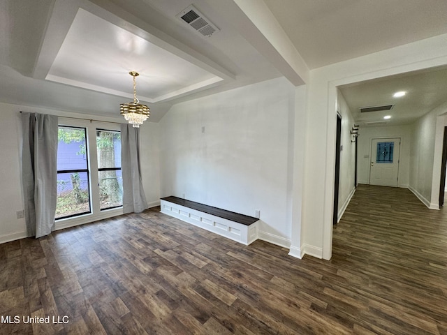 716 New Orleans St, Hattiesburg, MS 39401 - unfurnished dining area with a chandelier, dark wood-type flooring, a tray ceiling, and recessed lighting