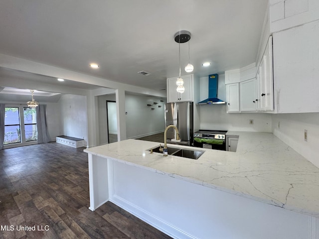 716 New Orleans St, Hattiesburg, MS 39401 - kitchen featuring wall chimney exhaust hood, stainless steel appliances, a peninsula, light stone counters, and white cabinets