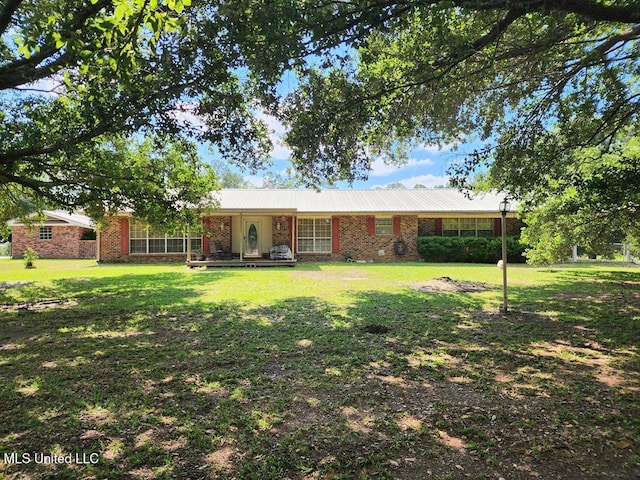 ranch-style home with a front lawn