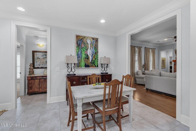 308 W Park St, Canton, MS 39046 - dining space with light tile patterned flooring, crown molding, ceiling fan, healthy amount of natural light, and baseboards