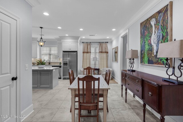 308 W Park St, Canton, MS 39046 - dining area with crown molding, recessed lighting, baseboards, and light tile patterned floors