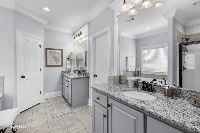 308 W Park St, Canton, MS 39046 - full bath with crown molding, a shower stall, two vanities, and recessed lighting