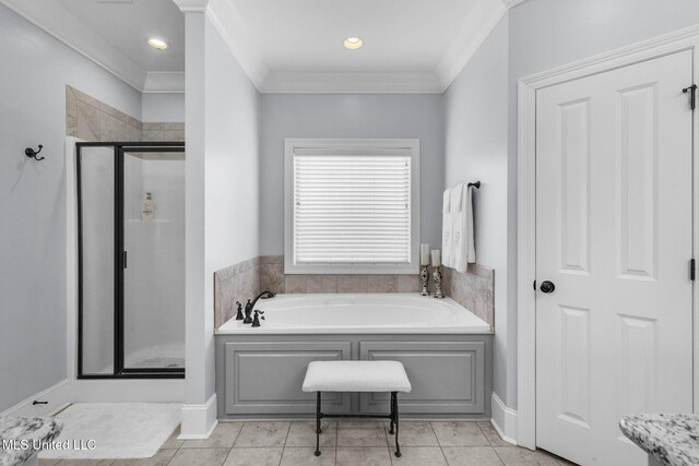 308 W Park St, Canton, MS 39046 - full bathroom with a garden tub, a stall shower, crown molding, tile patterned flooring, and baseboards