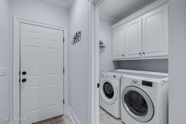308 W Park St, Canton, MS 39046 - washroom with washing machine and dryer, cabinet space, ornamental molding, and baseboards