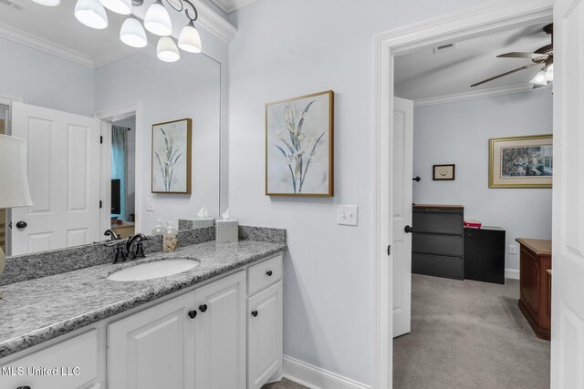 308 W Park St, Canton, MS 39046 - bathroom with ceiling fan, vanity, crown molding, and baseboards