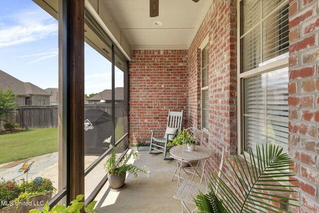 308 W Park St, Canton, MS 39046 - sunroom featuring brick wall and a ceiling fan