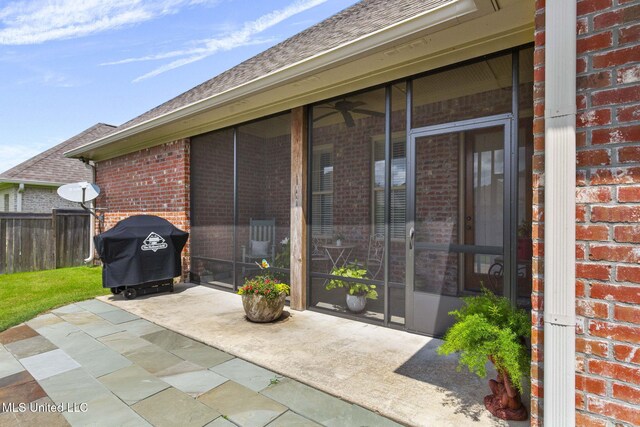 308 W Park St, Canton, MS 39046 - view of patio with a sunroom and area for grilling