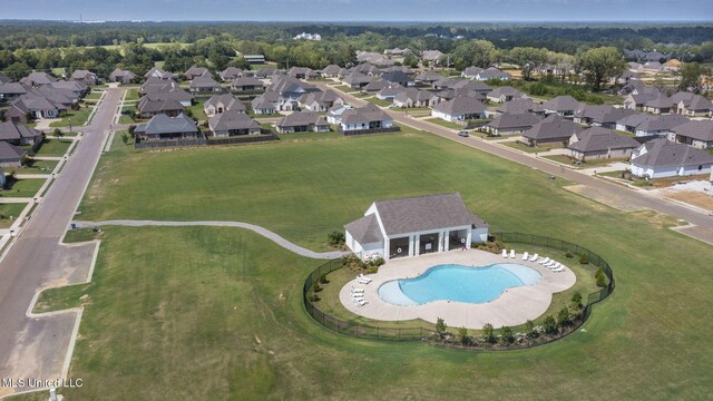 308 W Park St, Canton, MS 39046 - aerial view of property and surrounding area featuring a pool area and nearby suburban area