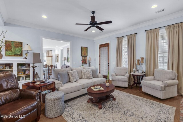 308 W Park St, Canton, MS 39046 - living room with wood finished floors, a ceiling fan, ornamental molding, and recessed lighting