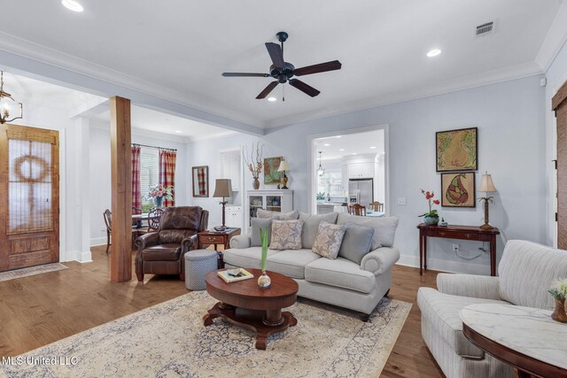 308 W Park St, Canton, MS 39046 - living area with a ceiling fan, crown molding, recessed lighting, wood finished floors, and baseboards