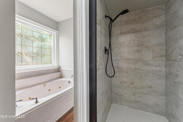 bathroom with shower with separate bathtub