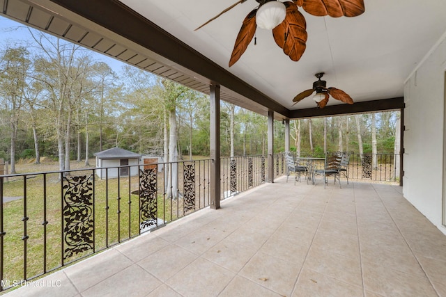 view of patio with an outbuilding