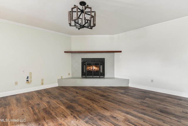 unfurnished living room featuring a tile fireplace, crown molding, and wood-type flooring