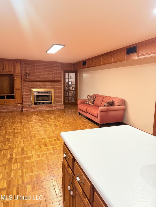 588 Robin Rd, Grenada, MS 38901 - kitchen with light parquet flooring and a brick fireplace