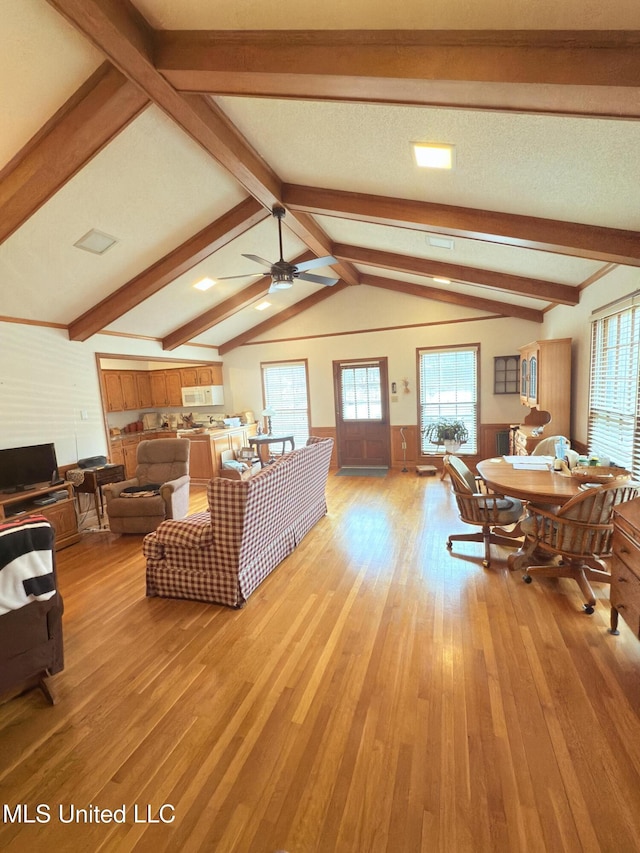 588 Robin Rd, Grenada, MS 38901 - living room with vaulted ceiling with beams, ceiling fan, and light wood-type flooring