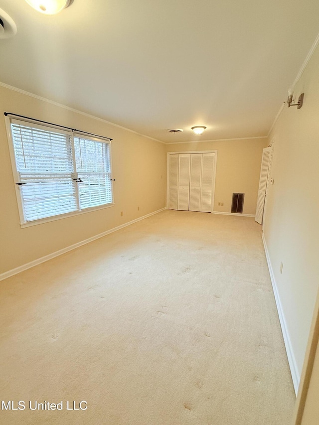 588 Robin Rd, Grenada, MS 38901 - empty room with crown molding and carpet flooring