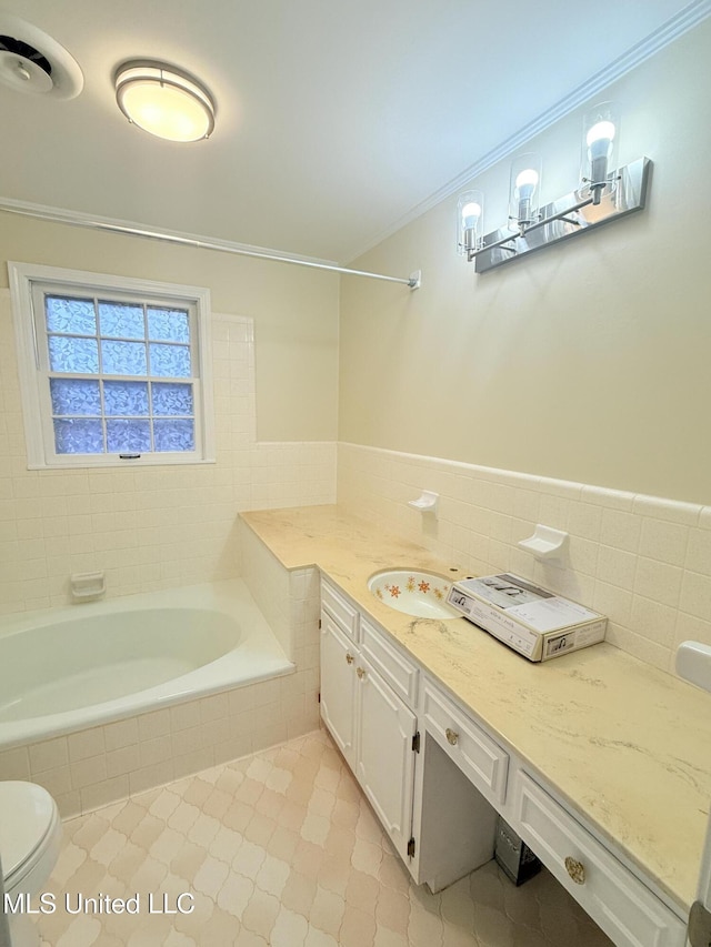 588 Robin Rd, Grenada, MS 38901 - full bathroom featuring tile walls, vanity, crown molding, and toilet