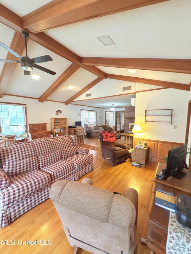 588 Robin Rd, Grenada, MS 38901 - living room with ceiling fan, wood-type flooring, and vaulted ceiling with beams