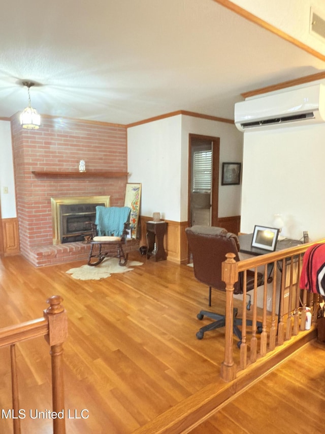 588 Robin Rd, Grenada, MS 38901 - office space featuring ornamental molding, a brick fireplace, hardwood / wood-style floors, and a wall unit AC