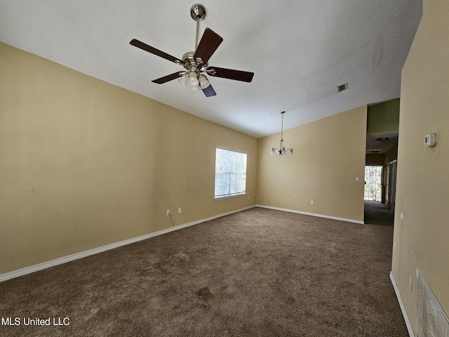 carpeted empty room with a textured ceiling, ceiling fan with notable chandelier, and lofted ceiling