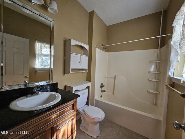 full bathroom with vanity,  shower combination, tile patterned floors, toilet, and a textured ceiling