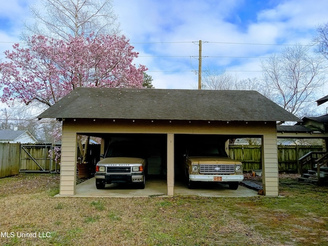 309 E Percy St, Indianola, MS 38751 - view of car parking featuring a yard and a carport