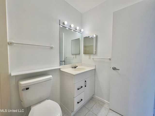 bathroom with toilet, marble finish floor, baseboards, and vanity