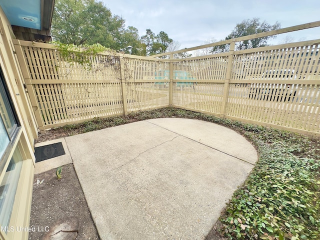 view of patio / terrace featuring fence