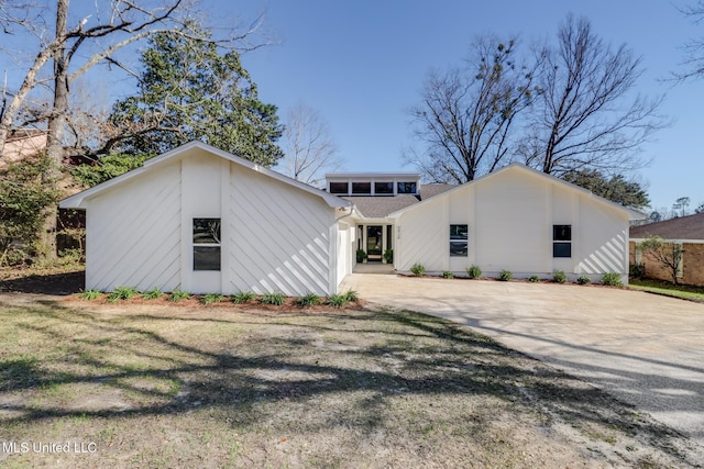 exterior space featuring concrete driveway