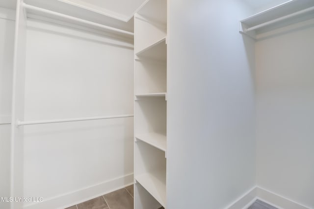 walk in closet featuring tile patterned floors