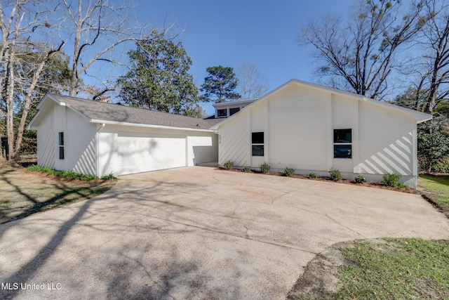 exterior space featuring a garage and driveway