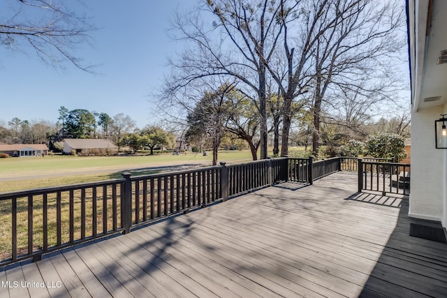 wooden deck with a yard