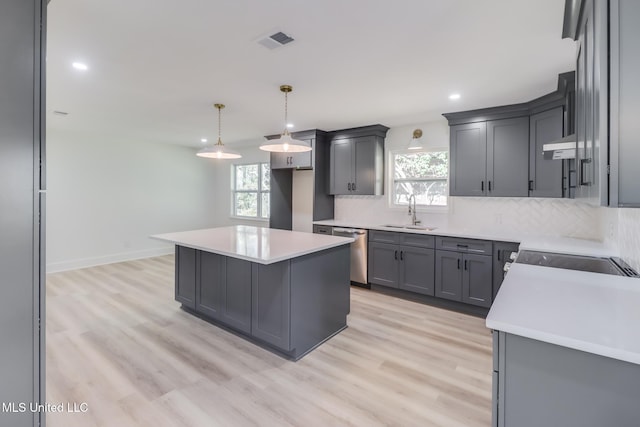 kitchen featuring visible vents, a sink, decorative backsplash, stove, and dishwasher