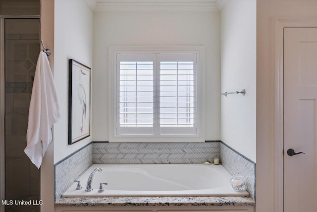 full bathroom with a tile shower and a garden tub