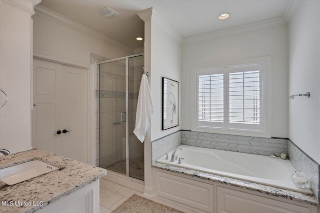 bathroom with visible vents, a garden tub, ornamental molding, a sink, and a shower stall