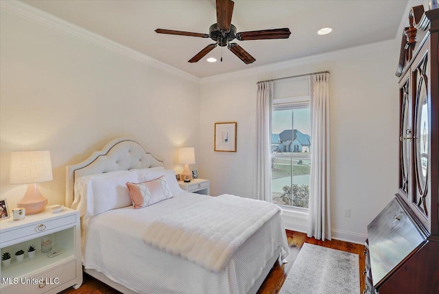 bedroom with recessed lighting, baseboards, ornamental molding, and dark wood finished floors