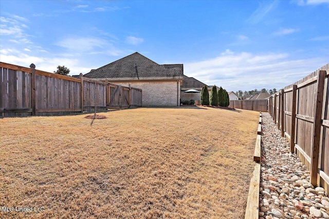 view of yard featuring a fenced backyard