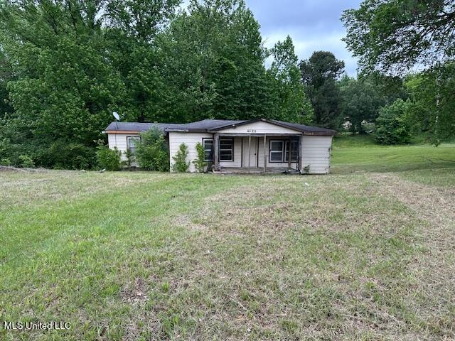view of front of home with a front yard