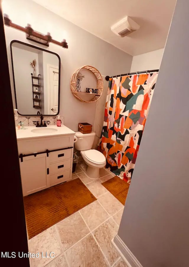 bathroom with vanity, a shower with curtain, and toilet