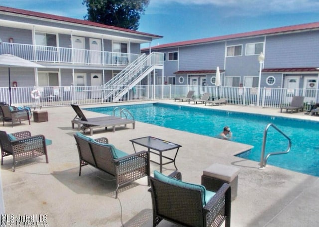 view of pool featuring a patio area