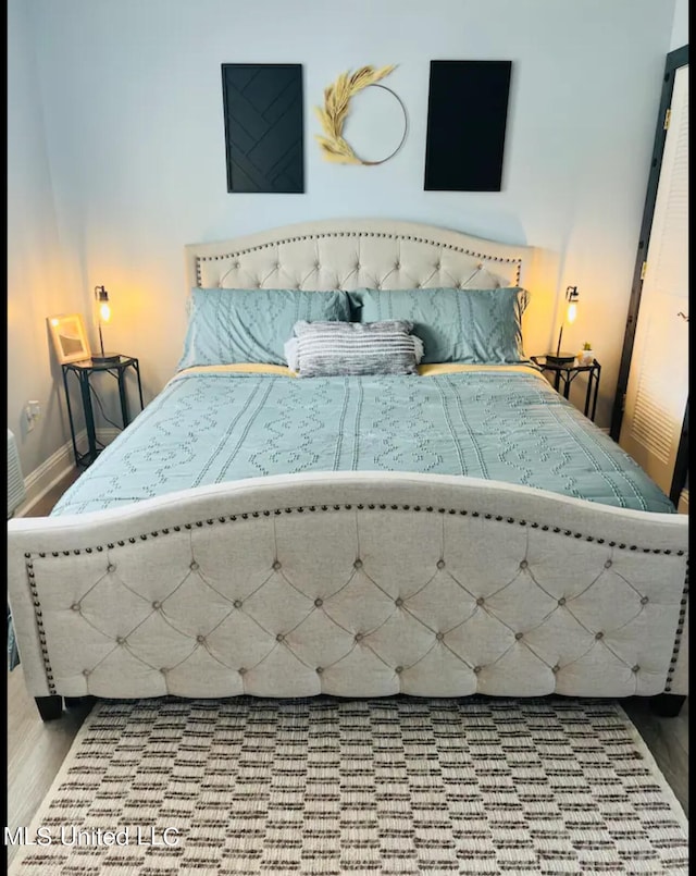 bedroom featuring hardwood / wood-style flooring