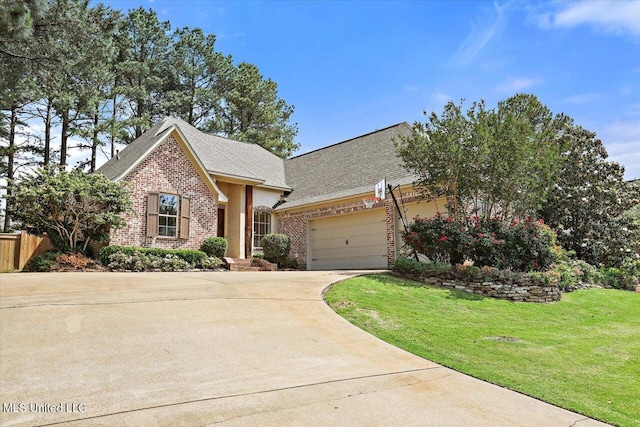 view of front of home featuring a front yard, brick siding, a shingled roof, an attached garage, and driveway
